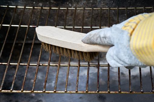 Dirty grill with grill brush